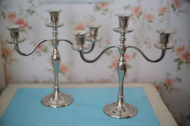 istock Silver Candelabra lighting up dark background 517185484