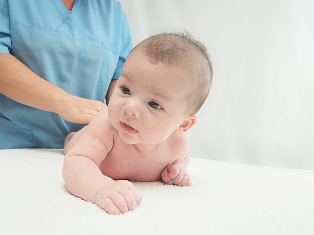 istock Doctor massage small caucasian baby 517185869