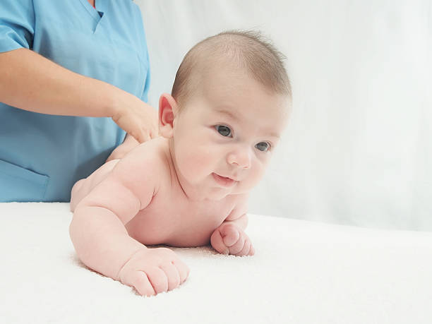 istock Doctor massage small caucasian baby 517185873