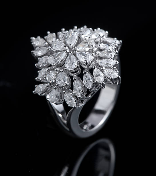 istock Diamond ring shot on a black reflective background 517186661