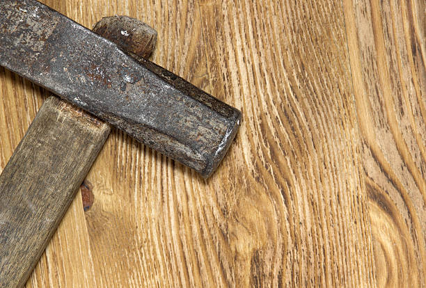 istock Old hammer on the wooden background 517186742
