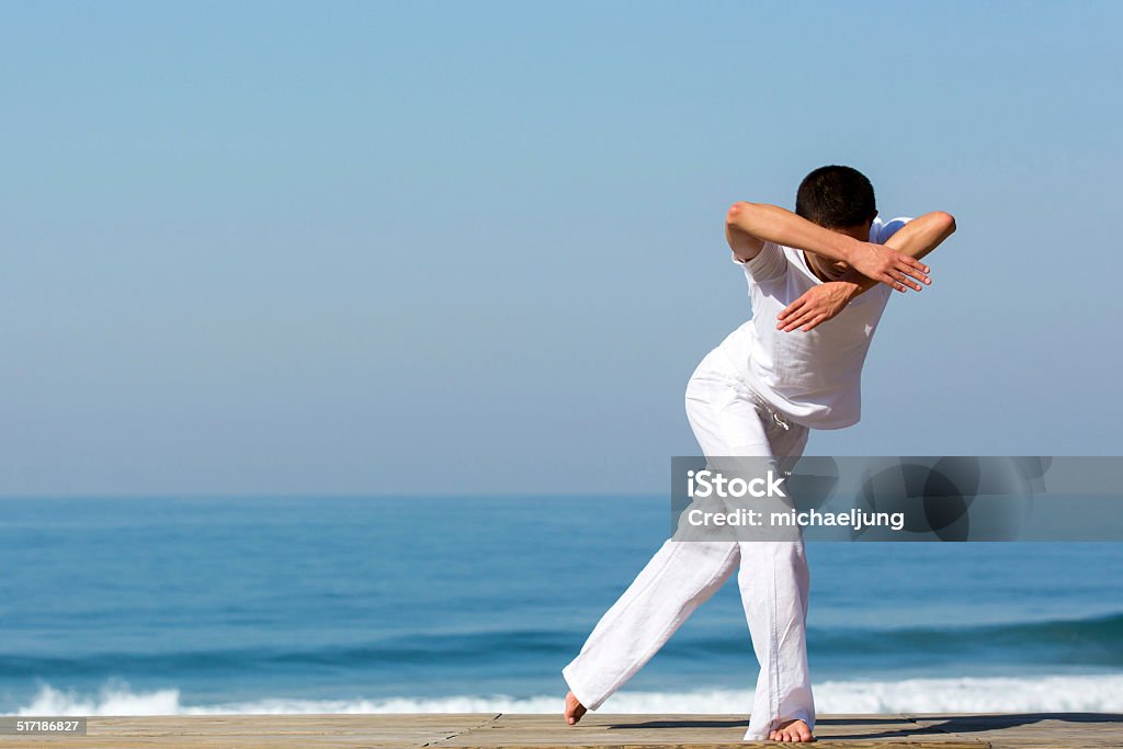 female dancer posing on the beach active female dancer posing on the beach Active Lifestyle Stock Photo