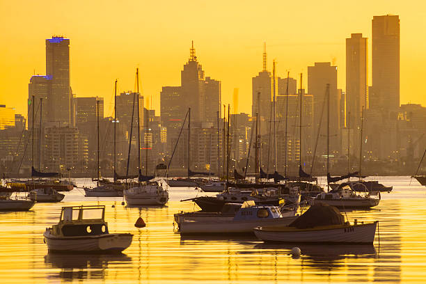 Melbourne's skyline, silhouetted at sunrise. Seen from Williamstown. 