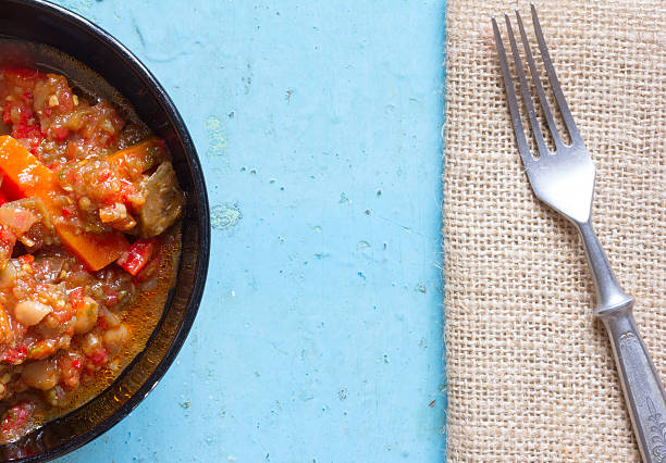 istock dish of stewed vegetables an old blue background 517188580