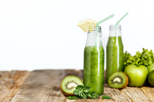 istock The bottles with fresh vegetable juices on wooden table 517190608