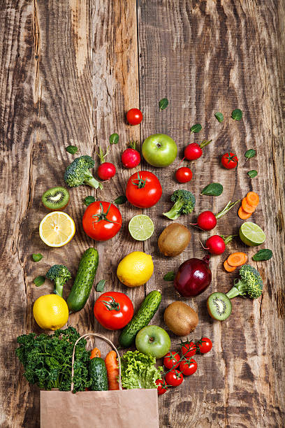 istock The vegetables from a paper bag on wooden table 517190844