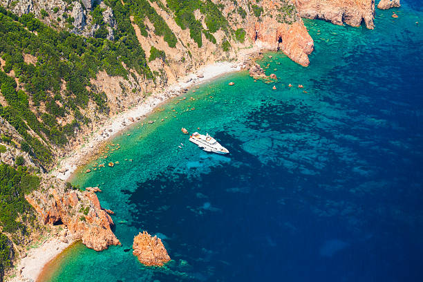 istock Landscape with rocks and pleasure motor yacht 517194546