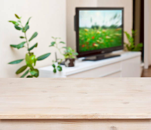istock Wooden table on lounge room interior background 517195921