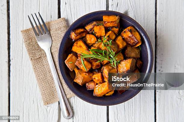 Bowl Of Oven Roasted Sweet Potato With Rosemary And Thyme Stock Photo - Download Image Now