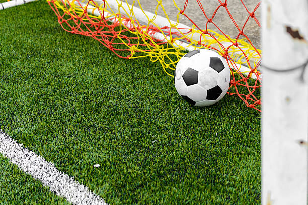 istock soccer ball in goal 517199915