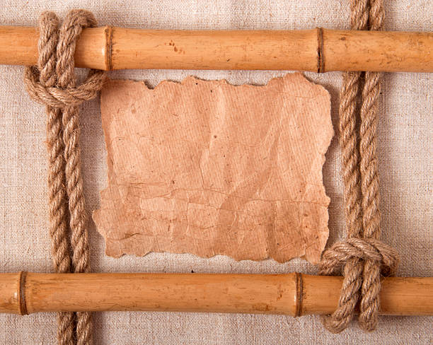 knot and old paper knot and old paper on the background of old cloth bamboo twist stock pictures, royalty-free photos & images