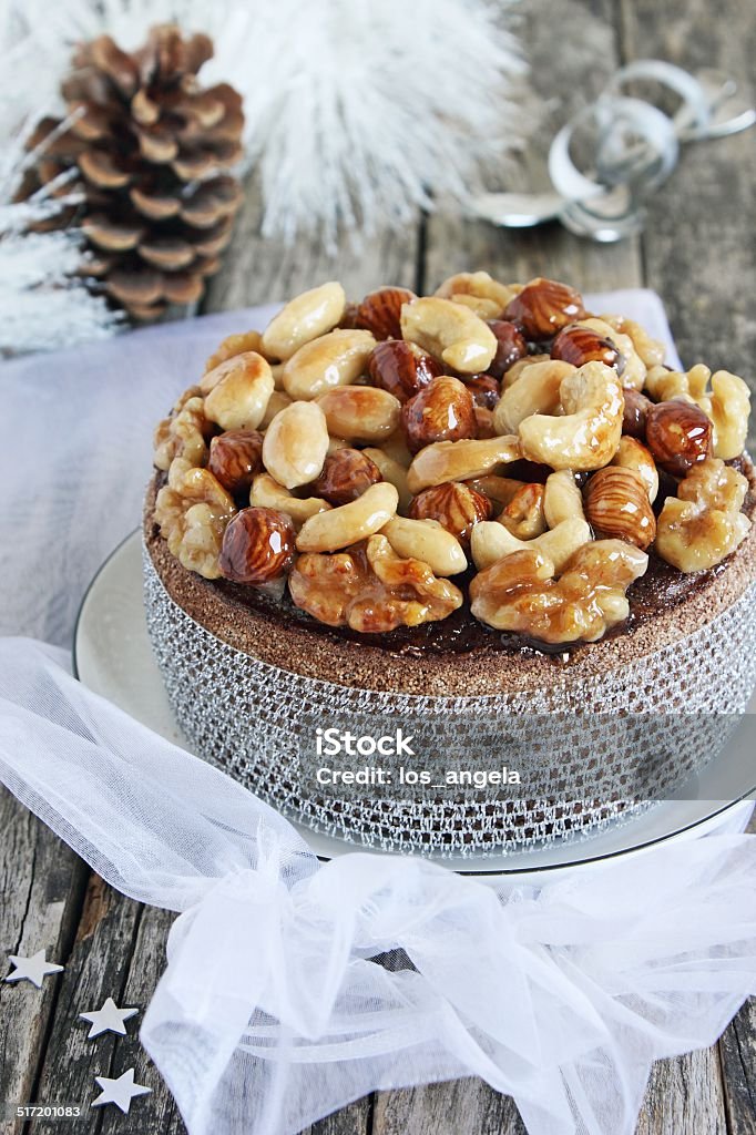 Christmas cake with caramelized nuts,chocolate and spices. Christmas cake with caramelized nuts,chocolate and spices.Traditional dessert. Advent Stock Photo