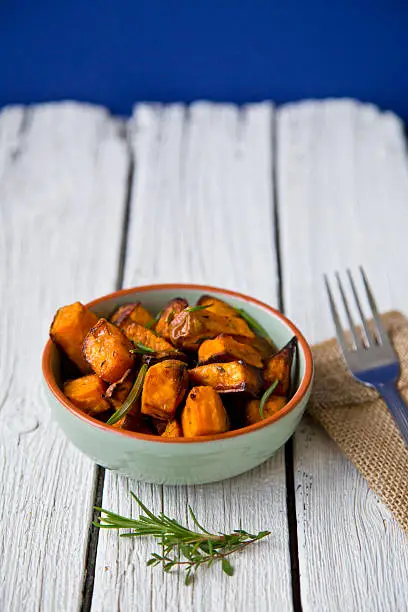 Oven roasted sweet potatoes with thyme and rosemary are a simple, delicious and healthy snack that contains lots of vitamins and serves as a natural energy booster