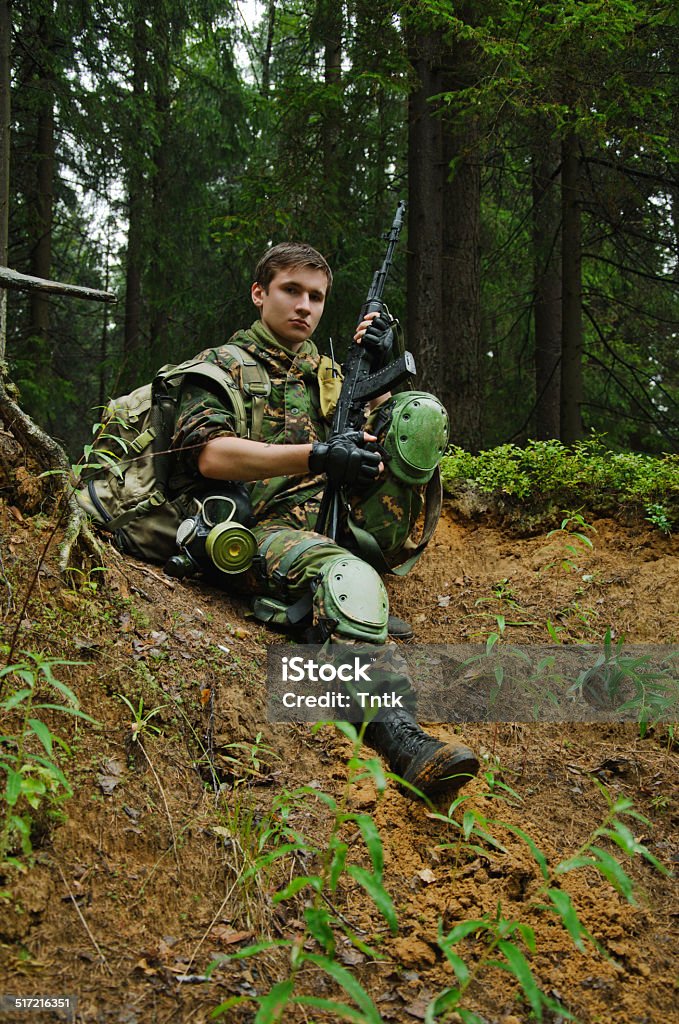 military military staged photography, soldiers in forest Armed Forces Stock Photo