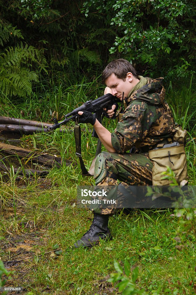 soldier in forest military staged photography Adult Stock Photo