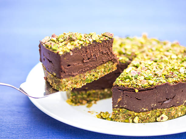 Vegan raw chocolate pistachio cake stock photo