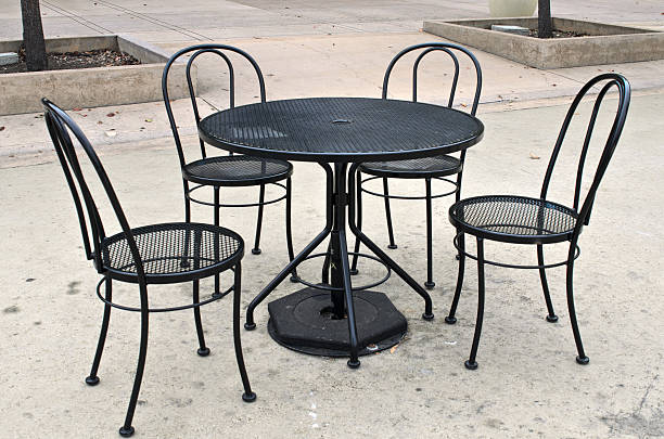 istock Black table and chairs in public park 517218801