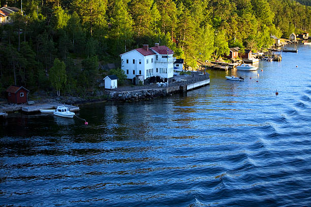 istock Norway sea and land with a tipical house 517220075