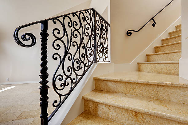 istock Marble staircase with black wrought iron railing 517222053