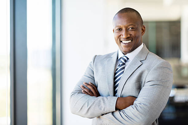 istock african american office worker with arms folded 517222718