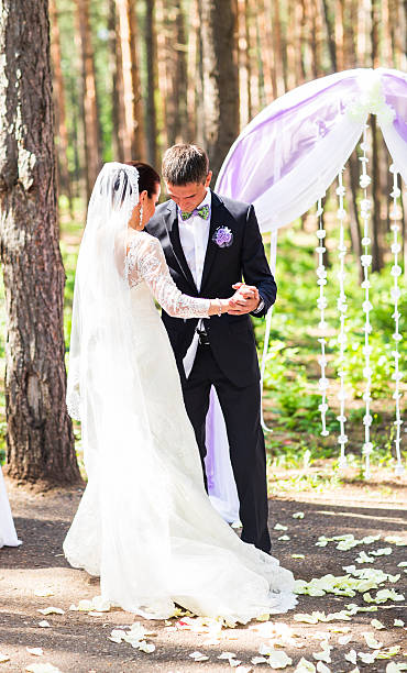 istock bride and groom dancing, wedding ceremony outdoors 517224142