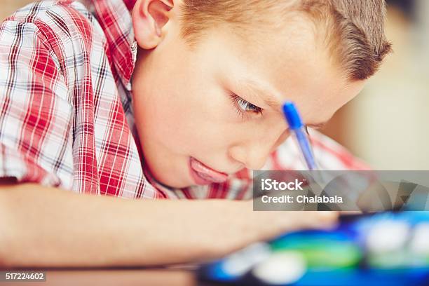 Little Boy Is Doing Homework Stock Photo - Download Image Now - Homework, Writing - Activity, Boys