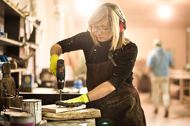 istock Woman operating with electric drill 517224934
