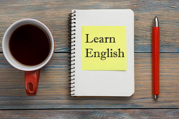 istock Learn English Text written on notebook page, red pencil and 517226402