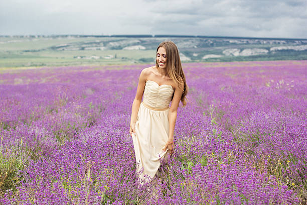 istock Girl is walking at lavender field 517228276