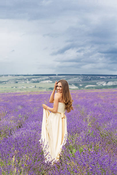istock Pretty girl is walking at lavender field 517228442