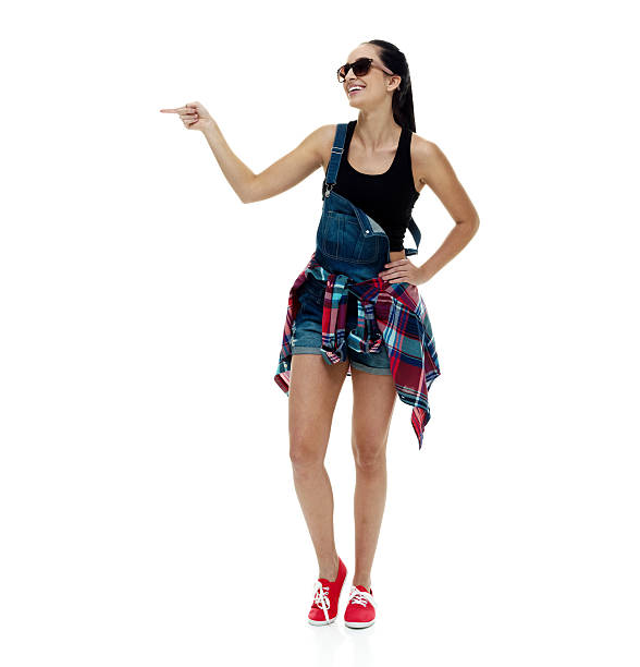istock Smiling female pointing away 517228626