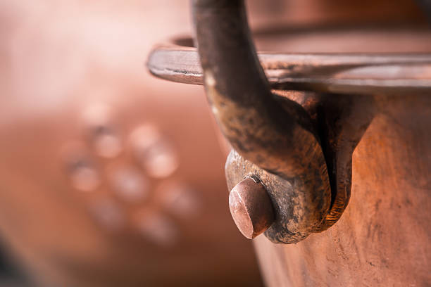 istock Fragment of the copper pots on blurred background 517228852