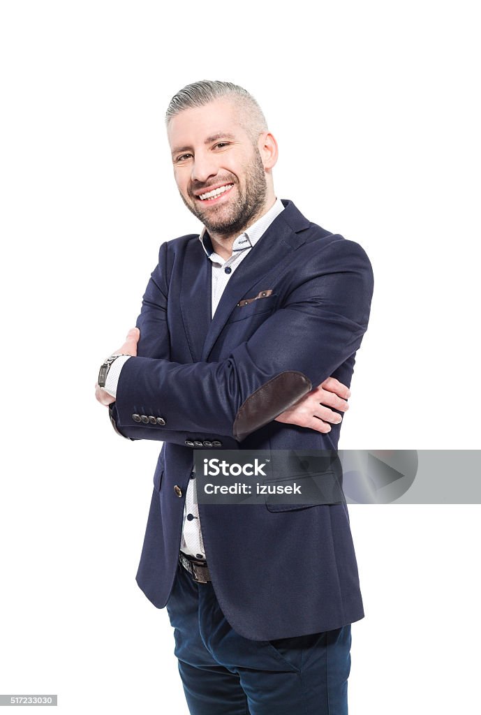 Charming bearded grey hair businessman, Studio Portrait Portrait of elegant bearded grey hair businessman wearing suit, smiling at camera. Studio shot, one person, isolated on white. Adult Stock Photo