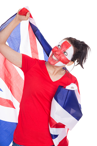 female english painted soccer fan with flag is looking happy, isolated on white