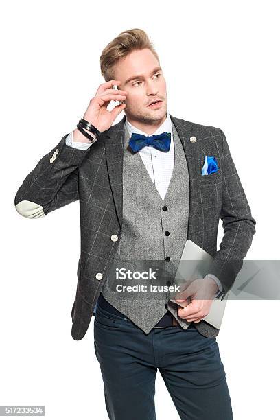 Fashionable Young Businessman In Classical Outfit Talking On Phone Stock Photo - Download Image Now