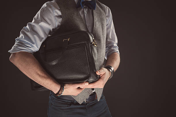 istock Man wearing tweed jacket, holding briefcase 517233932