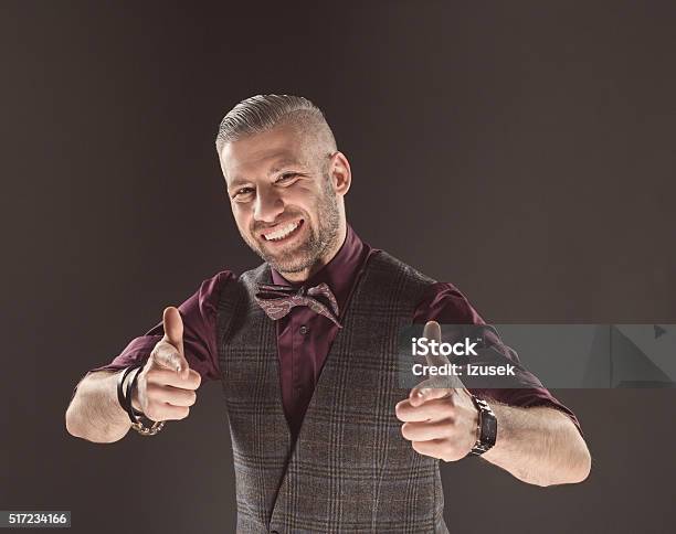 Successful Elegant Man Wearing Bow Tie And Tweed Vest Stock Photo - Download Image Now