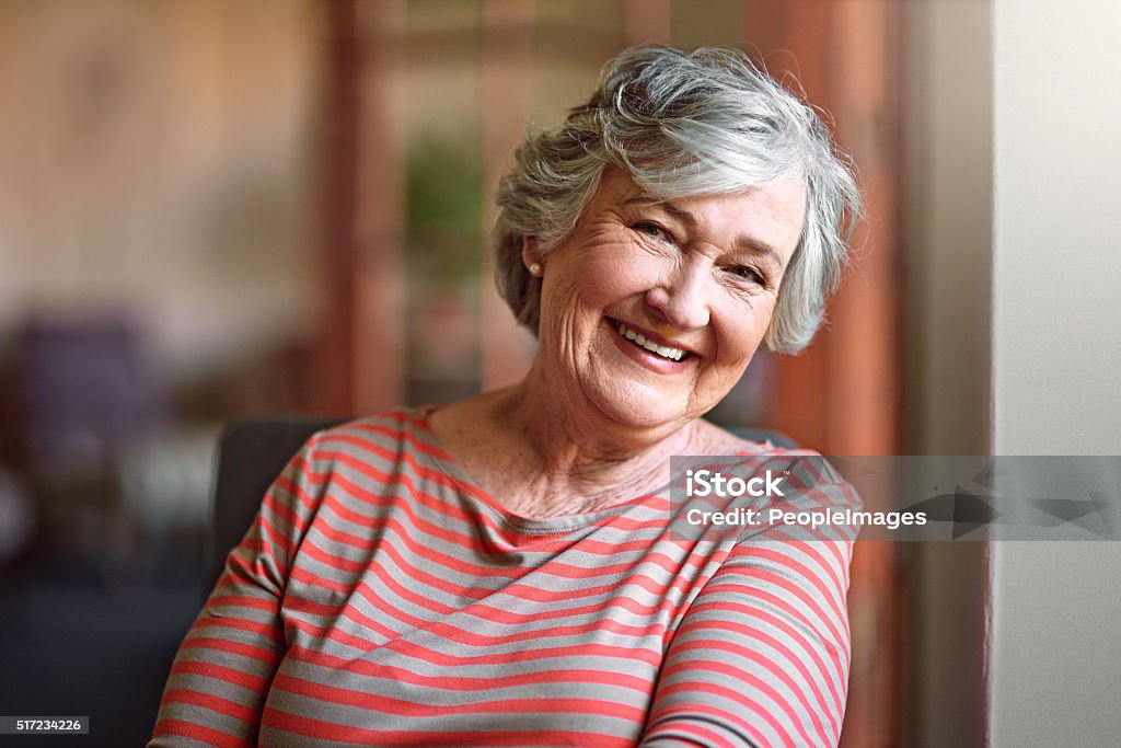 I see no good reason to act my age Shot of a senior woman relaxing at home Senior Women Stock Photo