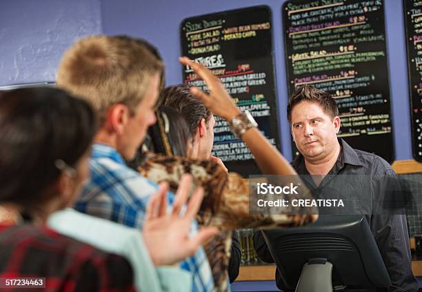 Annoyed Male Cafe Worker Stock Photo - Download Image Now - Customer, Displeased, Waiting In Line