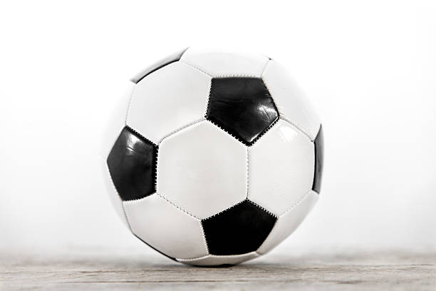 istock soccer ball in front of white 517234512