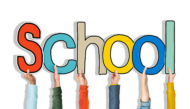 istock Diverse People's Hands Holding Word School 517234697