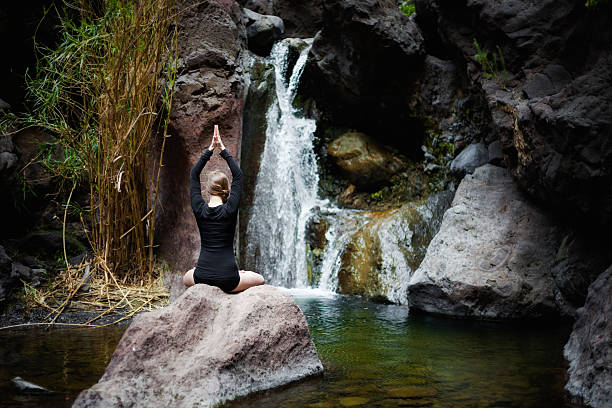 istock Meditation yoga session on rocks 517234866