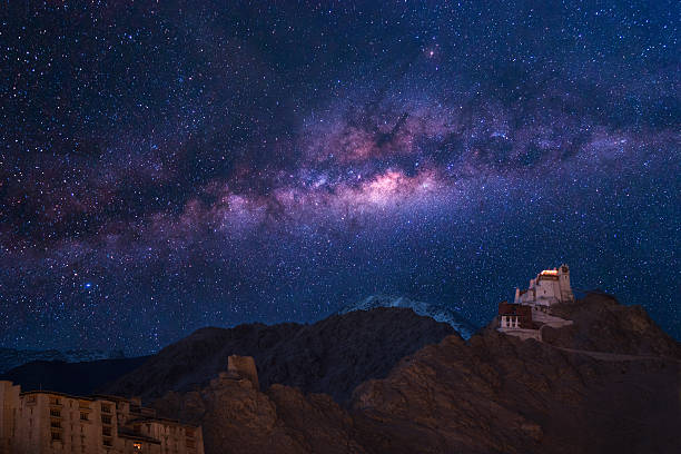 Namgyal Tsemo Gompa, main buddhist monastery centre in Leh, Ladakh Extreme long exposure image showing milky way with Namgyal Tsemo Gompa, main buddhist monastery centre in Leh, Ladakh, India ladakh region stock pictures, royalty-free photos & images