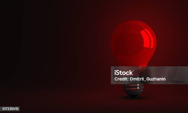 Red Glowing Light Bulb On Dark Background Stock Photo - Download Image Now - Concentration, Concepts, Concepts & Topics