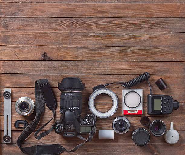 istock camera on the wooden table 517235776