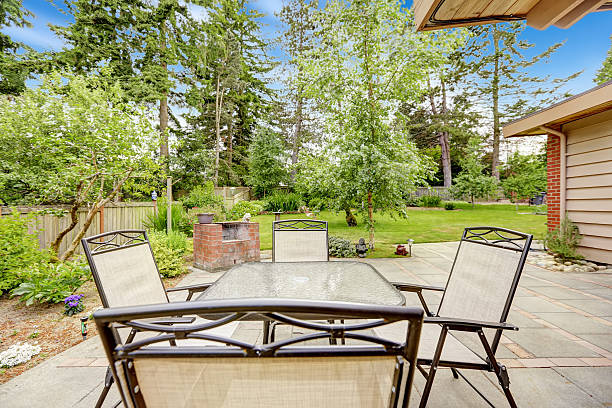 istock Walkout patio with concrete tile floor and table set 517235805