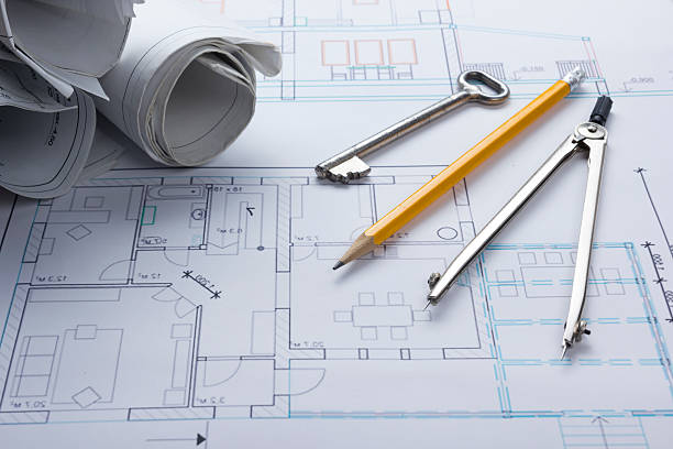istock Architect worplace top view. Architectural project, blueprints, blueprint rolls and 517236534