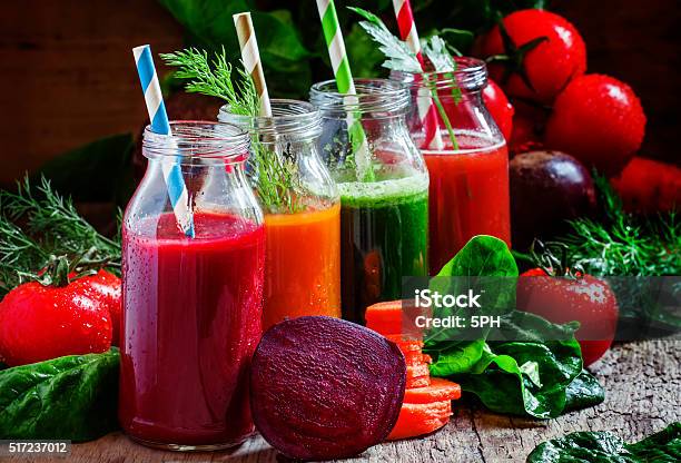 Freshly Squeezed Vegetable Juice In Bottles Stock Photo - Download Image Now - Bottle, Carrot, Cocktail