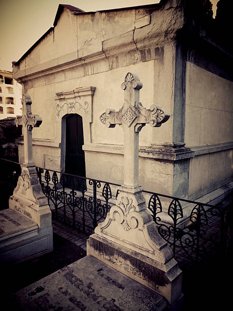 istock CROSSES IN FRONT OF A MAUSOLEUM 517237020