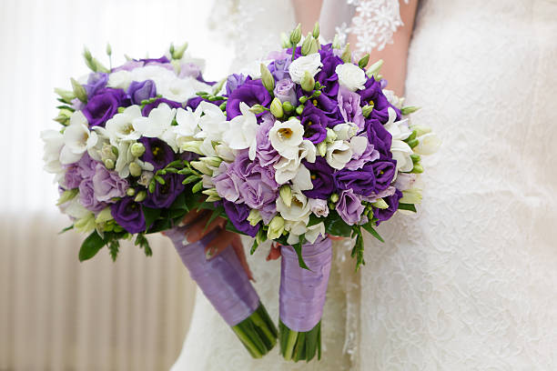 istock Wedding bunch of flowers in hands  the bride 517237777